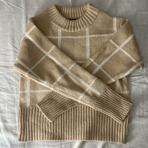 Woman’s long sleeve sweater size small from poof New York. Cream and white color